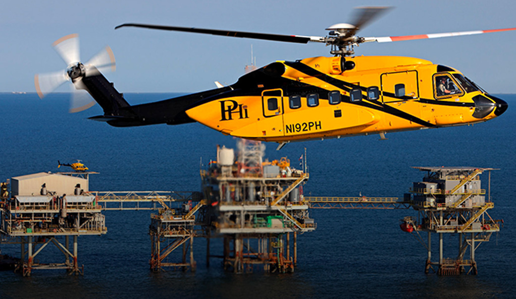 Helicopter over oil derrick